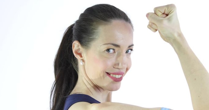 Attractive woman measuring her workout biceps