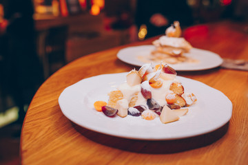 Eat sweet dessert cuisine tart food in cafe menu.Pastry products close up.Delicious menu item in restaurant.Enjoy fresh Layered cake vanilla custard served fruit slices peach exotic cream pie Diet.