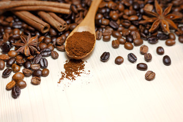 Coffee and spices on a light wooden table