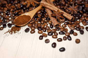 Coffee and spices on a light wooden table
