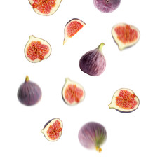 Set of falling delicious ripe figs on white background