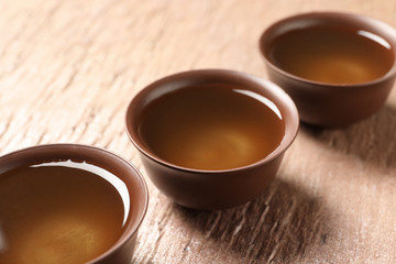 Cups of Tie Guan Yin oolong tea on table
