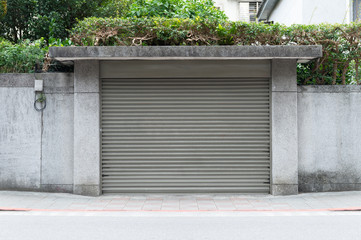 A closeup shot of automatic metal roller door used in factory, storage, garage, and industrial...