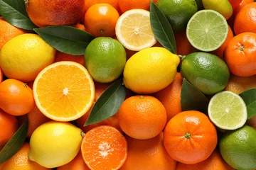 Foto op Plexiglas Different citrus fruits with leaves as background, top view © New Africa