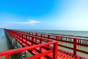 Bridge and ,Beautiful wooden red long bridge at samut sakhon province,Thailand is a dolphin view point called mutshanu shring