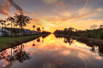 Golden sunset over a Gordon River tributary that winds through Golden Gate
