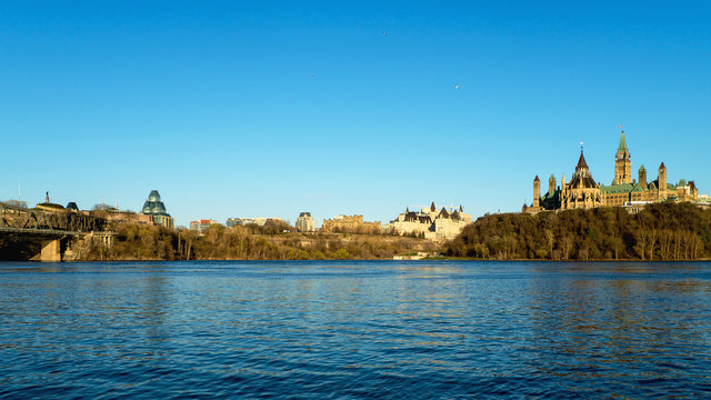 Sunset over Ottawa river and Parliament Hill in Ottawa, capital of Canada 