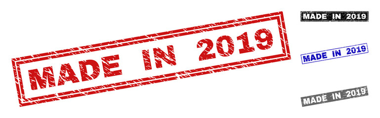 Grunge MADE IN 2019 rectangle stamp seals isolated on a white background. Rectangular seals with grunge texture in red, blue, black and gray colors.