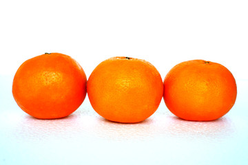 Close up of golden orange isolated on white background with copy and paste space