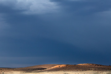 Fototapeta premium Moody sky over the Kalahari