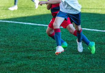 Football training soccer for kids. Boy runs kicks dribbles soccer balls. Young footballers dribble...