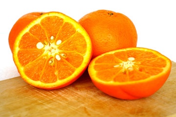 Close up of golden orange isolated on white background with copy and paste space