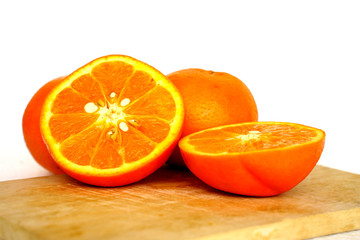 Close up of golden orange isolated on white background with copy and paste space