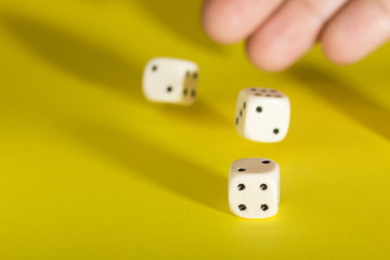 White gaming dices on yellow background. Victory chance and lucky. Place for text. Top view and Close-up cube. Concept business, gamble and game. Spectacular background pastel.