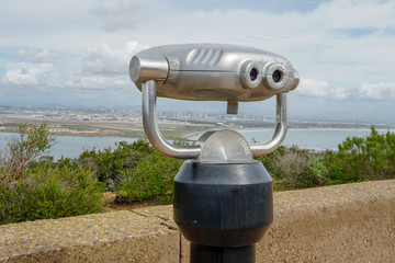 Paid binocular telescope on the tip of the Point Loma Peninsula in San Diego, California, USA. Close image of automated binoculars to observe San Diego city & bay. coin operated binoculars.