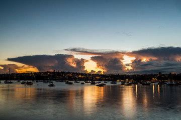 Clouds, sunrise and yachts