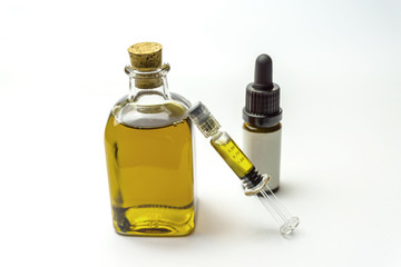 Cbd oil in glass bottles and syringe