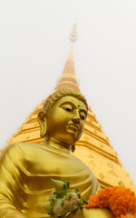 Buddha statue, Wat Phra That Doi Suthep in fog at Chiang mai province, Thailand.
