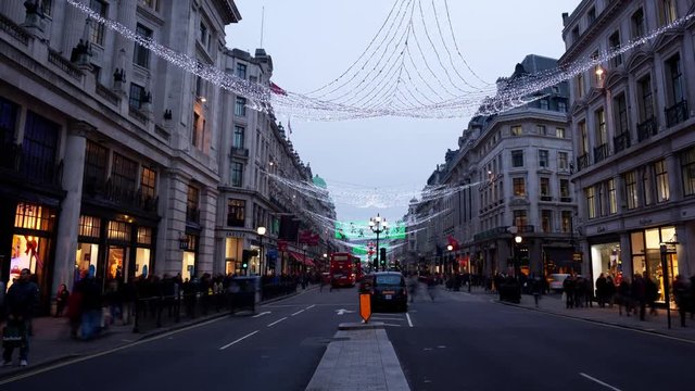 Day to night time-lapse of Regent street with Christmas lights at Christmas London England