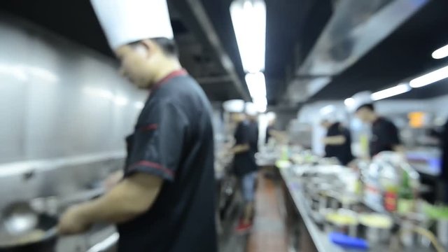 motion chefs of a restaurant kitchen