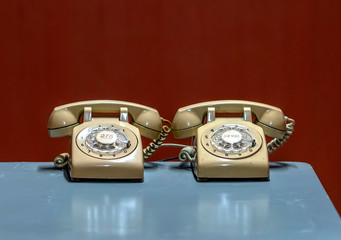 Old landline phone on the desk. They are manufactured from the 19th century as a means of communication by voice at that time