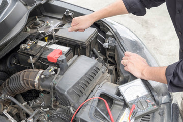 Fototapeta na wymiar Maintenance car repair automotive concept, Man checking car mechanic working under car hood in garage