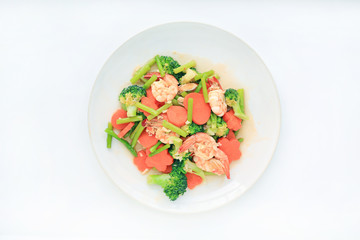 Fried Shrimp with vegetable on white plate against white background.