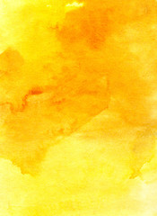 Abstract background. The texture of the paper, tinted with light and deep stains of yellow watercolor.