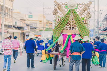 Happiness  villagers dressed in beautiful local costumes join the parade to celebrate Songkran Festival at Ban Nong Khao in Kanchanaburi, Thailand.