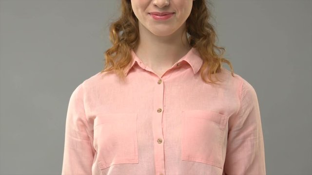 Female asking can i help you in sign language, showing words in asl tutorial