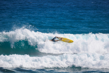 Surfer fall. Big wave. Atlantic Ocean.