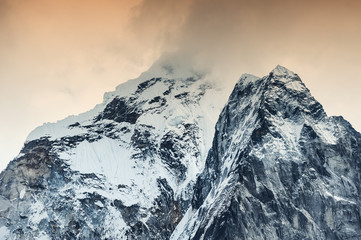 Ama Dablam peak with clouds at sunset, Himalaya mountains, Nepal