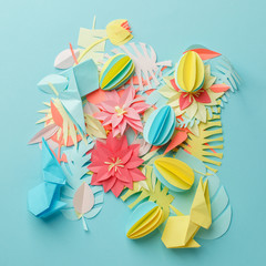 Chaos mess papercraft flowers and decor background, work in progress, paper details on pastel blue background, muted color