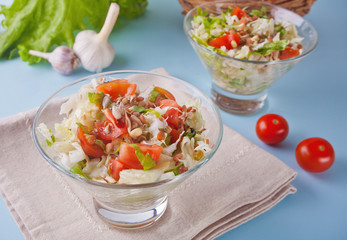mixed vegetable salad with tomatoes, onions, cabbage, sprouts of grain in a bowls