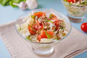 mixed vegetable salad with tomatoes, onions, cabbage, sprouts of grain in a bowls