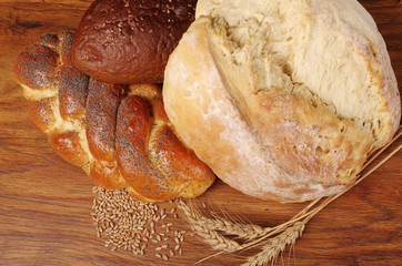 Loaves of bread, bread and spike on the table. Close-up