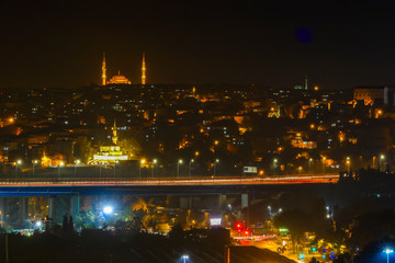 Istanbul, Turkey Night views from the Eyüp neighborhood over the Golden Horn.