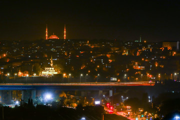 Istanbul, Turkey Night views from the Eyüp neighborhood over the Golden Horn.