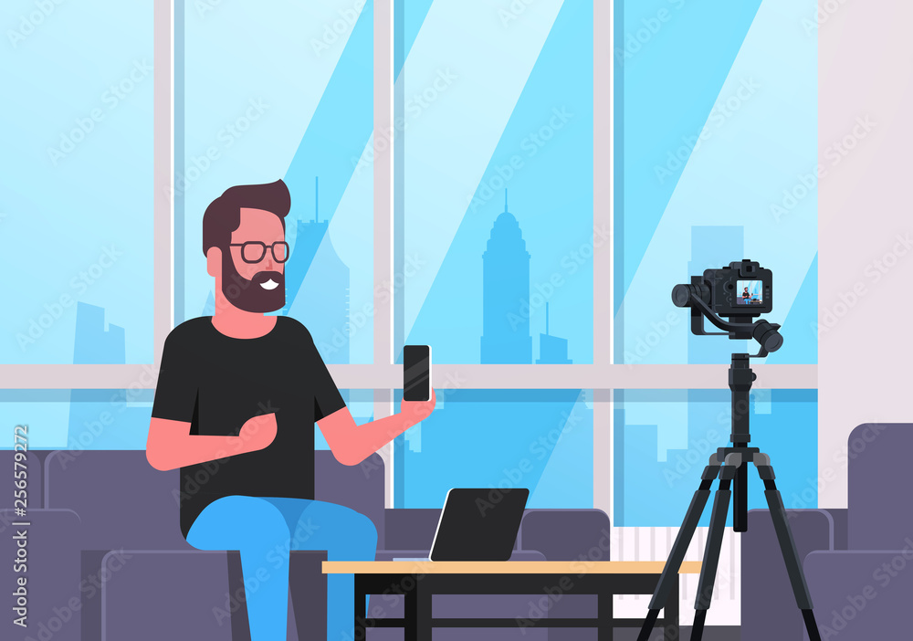 Poster guy technology blogger recording video on camera man showing new smartphone functional testing blog 