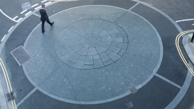 Businessman going round in circles themes of the way forward the next step confusion lost
