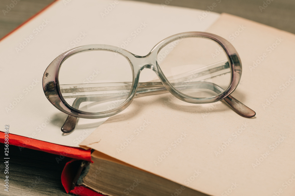 Wall mural book and glasses