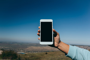 woman using mobile smart phone outdoor