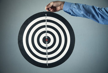 Businessman with dart board. Business goal concept