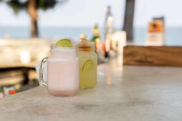 Healthy fresh lychee and lemon drink with slice of lime.