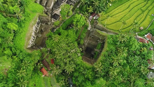 Birds View of Ancient Temple Gunung Kawi Fly flying over beautiful tropical landscape in Bali, Indonesia &ndash; Drone Footage