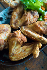 Fried chicken wings on dish