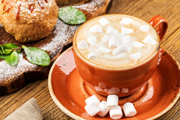 drink hot chocolate and marshmallows. marshmallows next to attributes.
