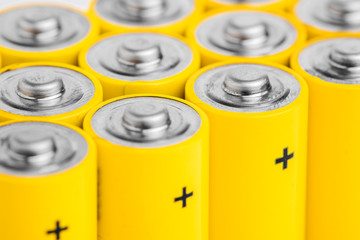 AA alkaline batteries on white background.