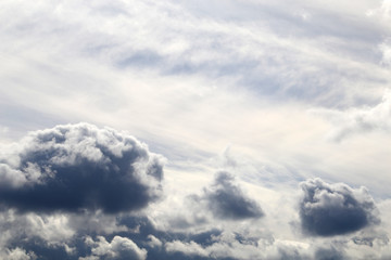 Storm sky covered with dark cumulus and cirrus clouds after the rain. Spring cloudy sky, overcast day, beautiful dramatic background for stormy weather