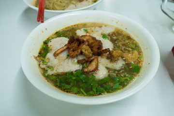 Egg noodle topping with red BBQ pork with soup